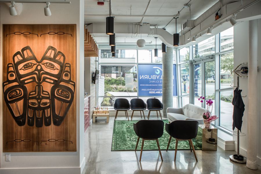 Hollyburn Eye Clinic — living moss wall feature with Hollyburn branding, North Vancouver
